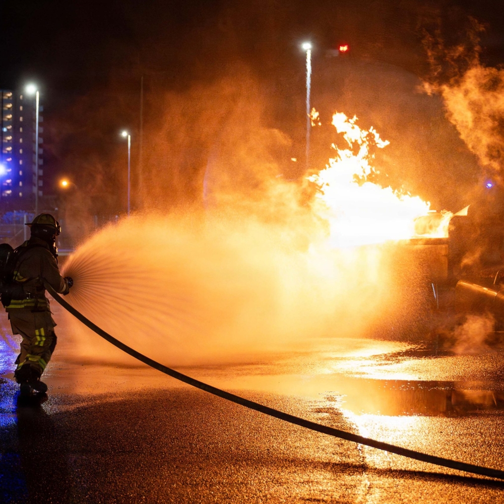 U.S. Air Force 18th Civil Engineer Squadron firefighters extinguish a simulated aircraft fire, during a USAF-led operational exercise, Beverly Midnight 26 at Kadena Air Base, Japan, March 12, 2026. BM26 enhances U.S. interoperability by fostering an exchange of information and refining shared tactics, techniques and procedures to better integrate defense capabilities in support of regional security. (Photo by U.S. Air Force Airman 1st Class Nathaniel Jackson)