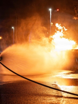U.S. Air Force 18th Civil Engineer Squadron firefighters extinguish a simulated aircraft fire, during a USAF-led operational exercise, Beverly Midnight 26 at Kadena Air Base, Japan, March 12, 2026. BM26 enhances U.S. interoperability by fostering an exchange of information and refining shared tactics, techniques and procedures to better integrate defense capabilities in support of regional security. (Photo by U.S. Air Force Airman 1st Class Nathaniel Jackson)