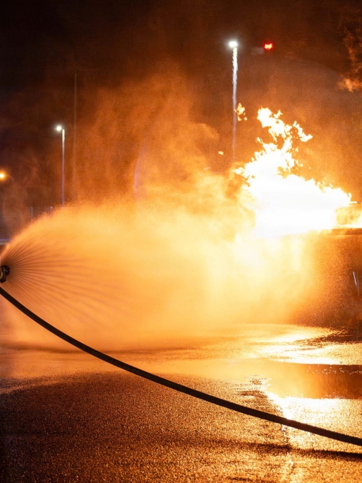 U.S. Air Force 18th Civil Engineer Squadron firefighters extinguish a simulated aircraft fire, during a USAF-led operational exercise, Beverly Midnight 26 at Kadena Air Base, Japan, March 12, 2026. BM26 enhances U.S. interoperability by fostering an exchange of information and refining shared tactics, techniques and procedures to better integrate defense capabilities in support of regional security. (Photo by U.S. Air Force Airman 1st Class Nathaniel Jackson)